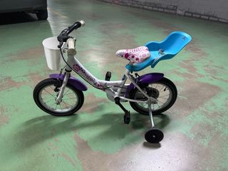 Bicicleta infantil con ruedines y asiento