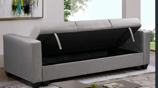 Sofá cama azul con arcón