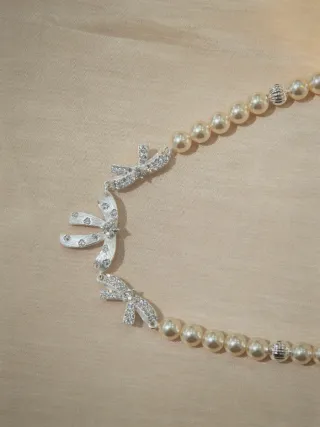 Collana perle 6mm crema 42cm con fiocchi