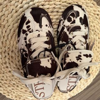 Zapatillas destalonadas print vaca Stradivarius