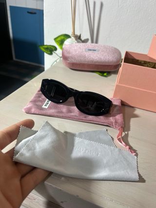 Occhiali da sole Miu Miu donna neri e oro