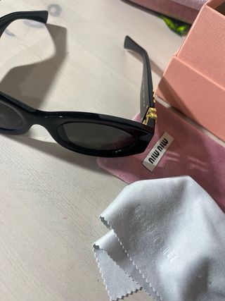 Occhiali da sole Miu Miu donna neri e oro