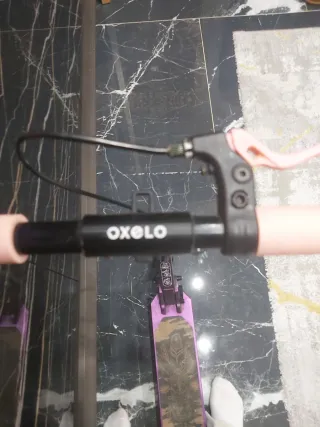 Patinete Oxelo morado buen estado