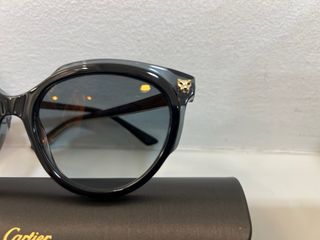 Gafas de sol Cartier negras y doradas