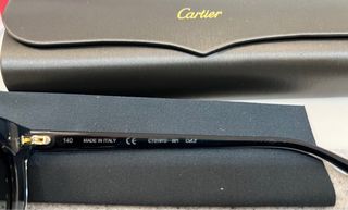 Gafas de sol Cartier negras y doradas