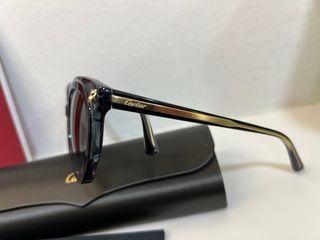 Gafas de sol Cartier negras y doradas