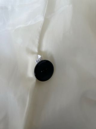 Abrigo blanco estructurado tipo paño polar