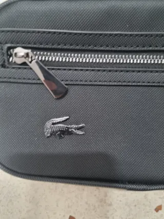 Lote de dos riñoneras louis vuitton i lacoste