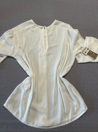 Blusa bianca con dettagli oro