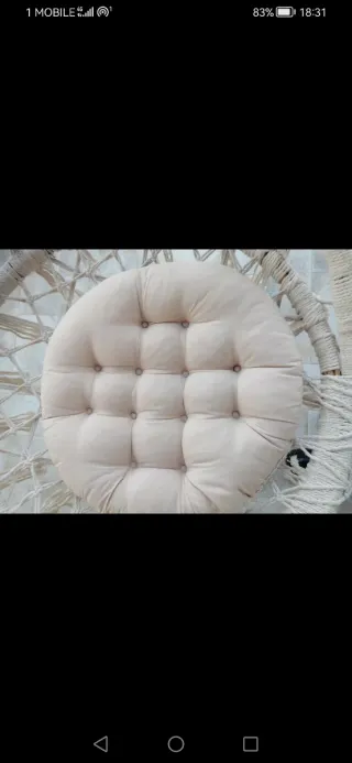 Cuscino rotondo beige in tessuto