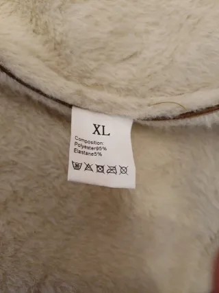 Cazadora de piel marrón y blanca