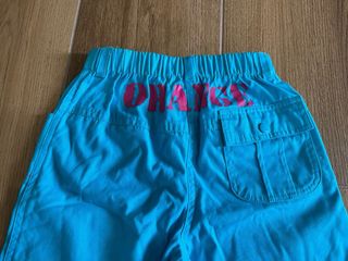 Pantaloni bambina azzurri con fiori fucsia 8 anni