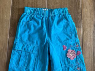 Pantaloni bambina azzurri con fiori fucsia 8 anni