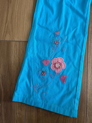 Pantaloni bambina azzurri con fiori fucsia 8 anni