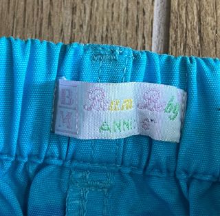 Pantaloni bambina azzurri con fiori fucsia 8 anni