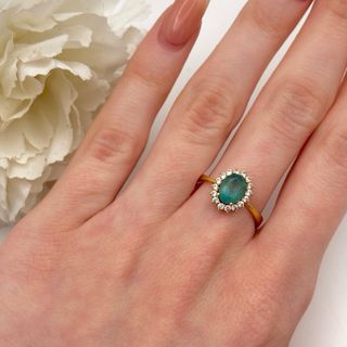 Anillo oro 18kt con esmeralda y circonitas