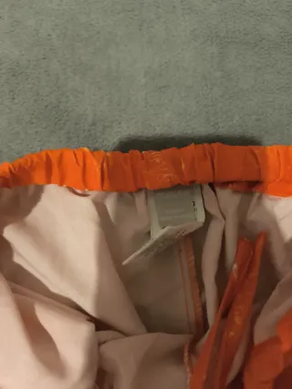 Pantalón hippie naranja estampado sol