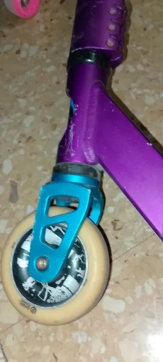 Patinete freestyle morado y negro