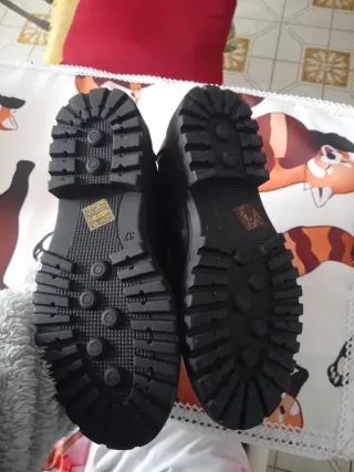 Mocassini Zoe neri con fibbia oro n°37