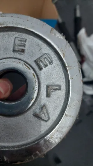 Set di pesi e barre per palestra