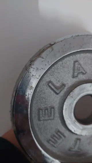 Set di pesi e barre per palestra