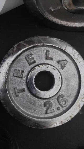 Set di pesi e barre per palestra