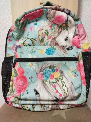 Mochila escolar naranja con estampado floral