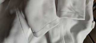 Chaqueta, careta y guante de esgrima.
