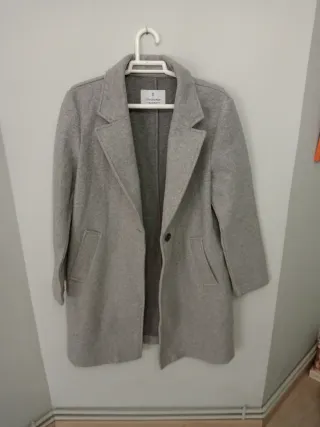 Abrigo gris jaspe botón bolsillos