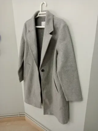 Abrigo gris jaspe botón bolsillos