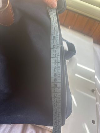 Borsone da viaggio blu scuro con dettagli marroni