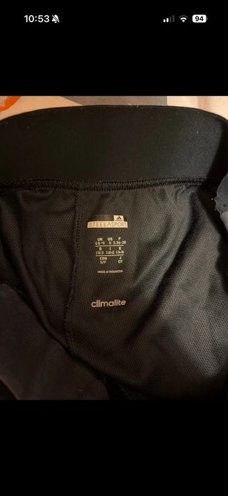 Pantaloni tuta Adidas neri con dettagli rossi