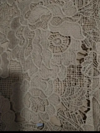 Pantalón de punto y crochet beige.