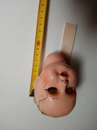 Teste di bambole antiche
