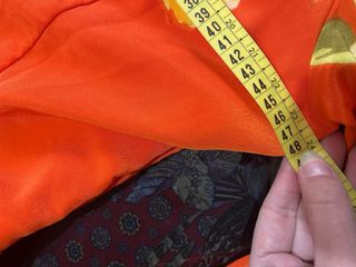 Traje de flamenca naranja con flores