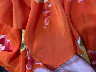 Traje de flamenca naranja con flores