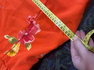 Traje de flamenca naranja con flores