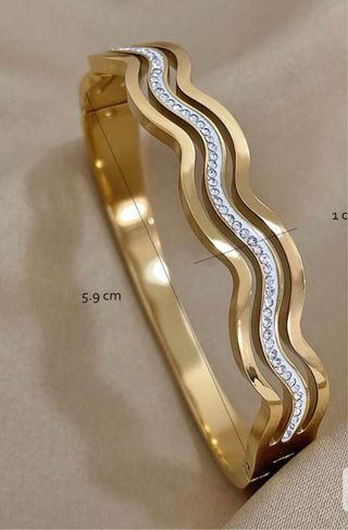 Pulsera dorada con ondas y cristales