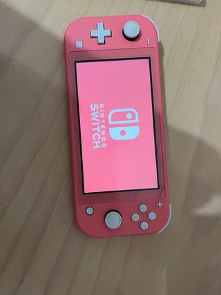 Nintendo Switch Lite Coral + Juego