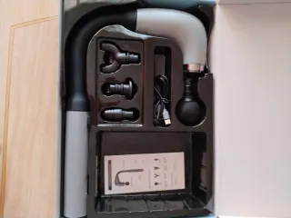 Masajeador eléctrico con accesorios