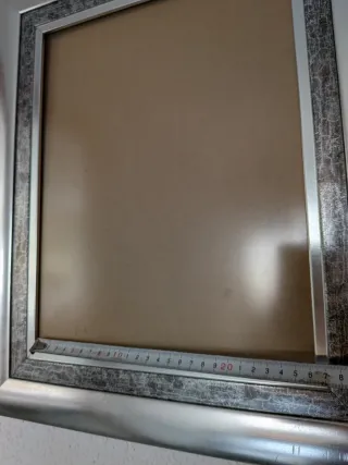 Marcos de fotos plateados y marrones