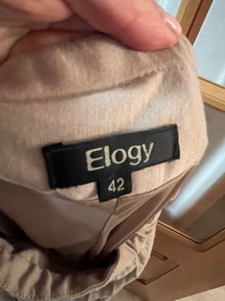 Falda plisada larga de seda beige de Elogy 42