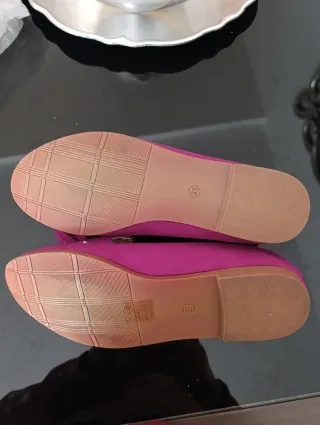 Zapatos planos fucsia con detalle de flecos