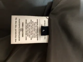 Abrigo de piel con capucha 100%