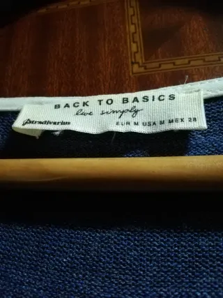 Jersey de mujer azul con capa blanca