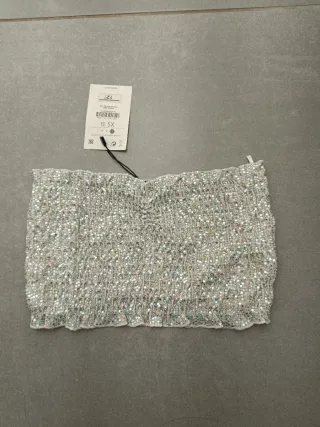 Top lentejuelas plateadas talla XS