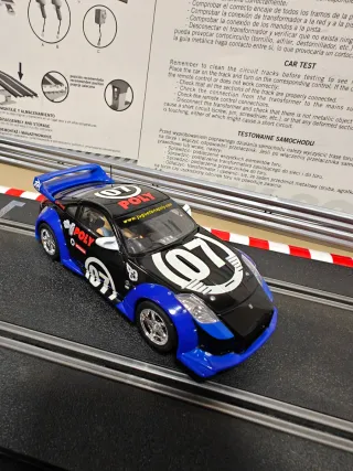 Lote 2 coches slot Carrera Evolution Nissan y Audi