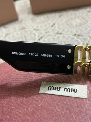 Occhiali Miu Miu neri e oro