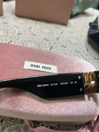 Occhiali Miu Miu neri e oro