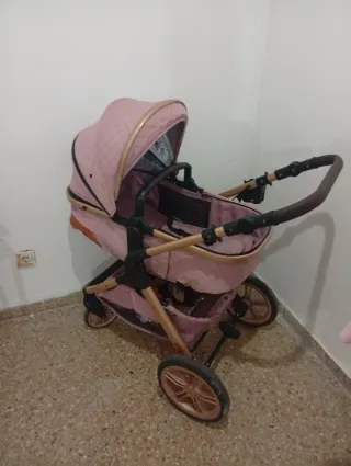 Carrito de bebé rosa